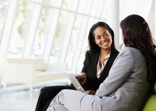 Businesswomen With Digital Tablet Sitting In Modern Office Businesswomen With Digital Tablet Sitting In Modern Office